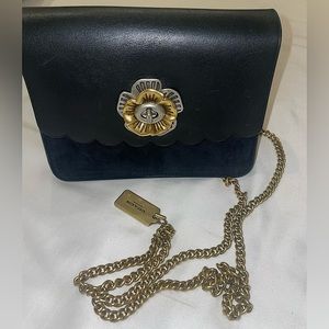 Black Coach bag w/ Flower Closure